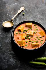Green peas or matar paneer curry recipe, served in a bowl. selective focus