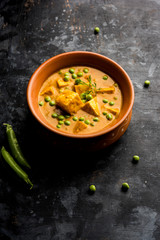 Green peas or matar paneer curry recipe, served in a bowl. selective focus