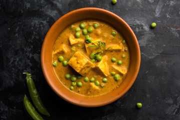 Green peas or matar paneer curry recipe, served in a bowl. selective focus