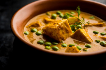 Green peas or matar paneer curry recipe, served in a bowl. selective focus