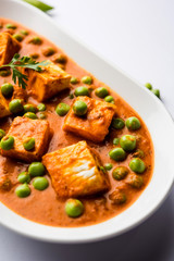 Green peas or matar paneer curry recipe, served in a bowl. selective focus