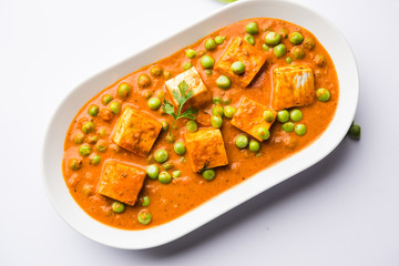 Green peas or matar paneer curry recipe, served in a bowl. selective focus