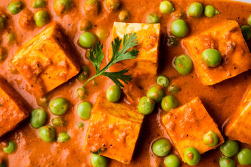 Green peas or matar paneer curry recipe, served in a bowl. selective focus