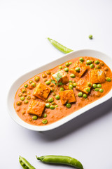 Green peas or matar paneer curry recipe, served in a bowl. selective focus