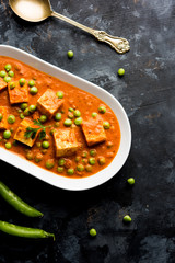 Green peas or matar paneer curry recipe, served in a bowl. selective focus
