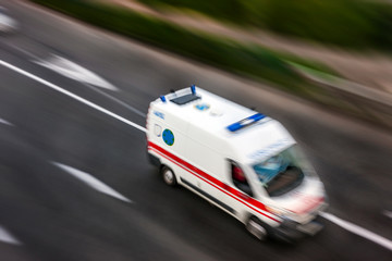Ambulance in the city on a blurred background . © Zadiraka