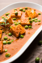 Green peas or matar paneer curry recipe, served in a bowl. selective focus