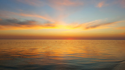 Fototapeta na wymiar The sun was behind the horizon at the sea