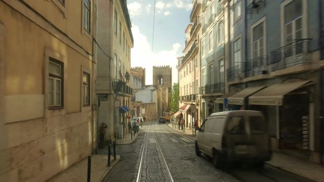 LISBON, PORTUGAL - NOVEMBER 21, 2018: Traveling by tram through old Lisbon. Shots from the rear platform of the tram line 28