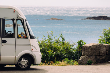 Fototapeta na wymiar Camper car on coast of Norway with ocean view