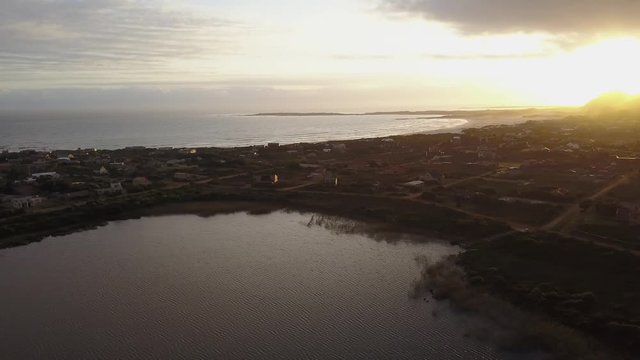 Aerail view of sunset over lake and beach front
