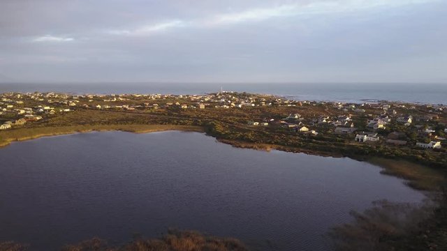 Aerial view of lake and beach front during sunset