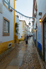 OBIDOS, PORTUGAL - NOVEMBER 20, 2018: Obidos remains a well-preserved example of medieval architecture; its streets, squares, walls and its castle are a popular tourist destination