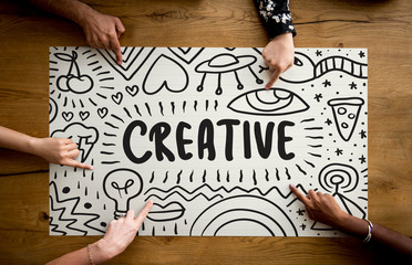 Fingers pointing at a creative idea typography