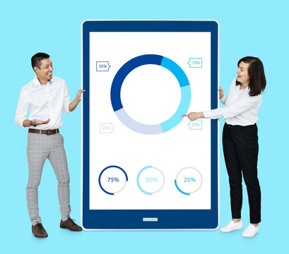 Businesspeople Presenting A Doughnut Chart