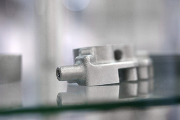 Selective Laser Melting. Object printed on metal 3d printer. Model created in laser sintering machine. DMLS, SLM, SLS technology. Concept of 4.0 industrial revolution. Progressive additive technology.