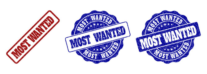 MOST WANTED grunge stamp seals in red and blue colors. Vector MOST WANTED labels with grunge style. Graphic elements are rounded rectangles, rosettes, circles and text tags. © Tensor Designs