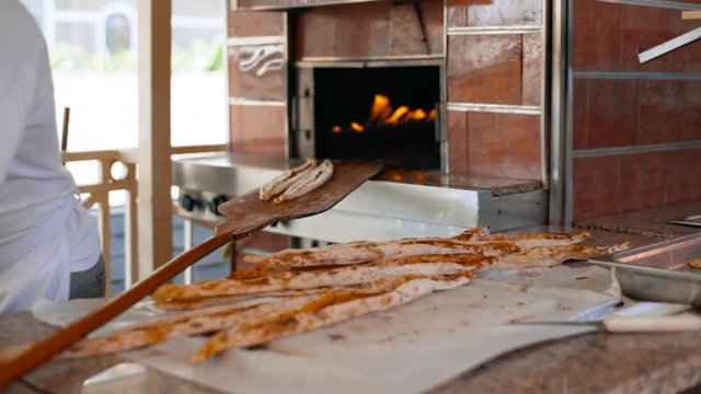 A man prepares delicious traditional Turkish cakes Pida. 4k
