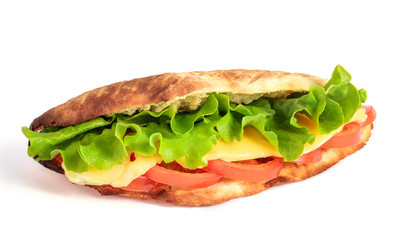 Sandwich from fresh pita bread with lettuce, slices of fresh tomatoes, ham pork and cheese on white background