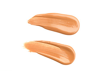 Light beige makeup smear of creamy foundation isolated on white background. Light beige creamy foundation texture isolated on white background
