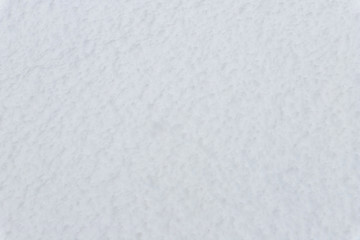 Texture of wet snow on the ground. Snowdrift melting.