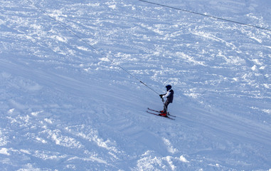 A man snowboarding a mountain in the snow in winter