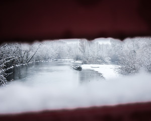 View through bridge while snowing