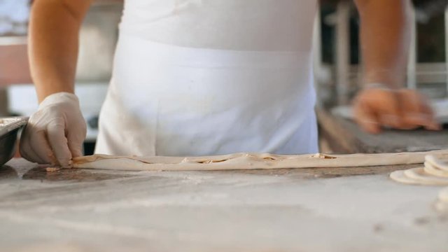 A man prepares delicious traditional Turkish cakes Pida. 4k