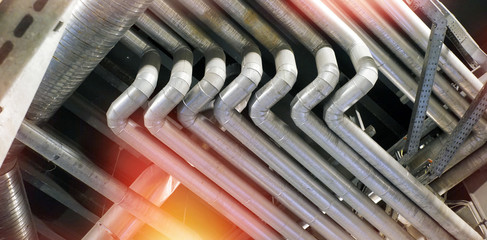 Equipment, cables and piping as found inside of a modern industrial power plant