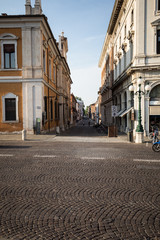 Ferrara, Italy - June 10, 2017: Street in historical center of Ferrara, Italy