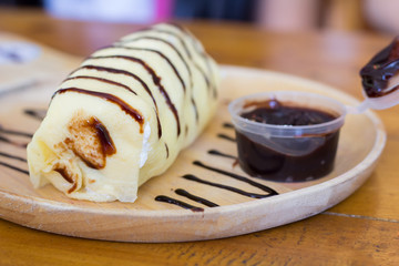 Abstract dessert banana on the wooden table. selective focus blurred in the other.