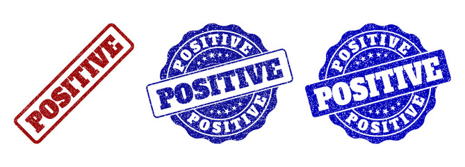 Obraz premium POSITIVE grunge stamp seals in red and blue colors. Vector POSITIVE labels with scratced effect. Graphic elements are rounded rectangles, rosettes, circles and text labels.