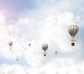 Flying hot air balloons in the air.