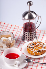 red tea with icing and raisin cake