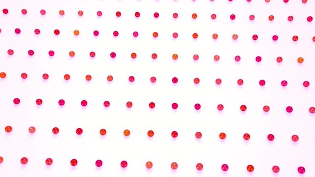 christmas balls on surface in a rows. 3d animation for new year compositions or background with depth of field. amera moves smoothly above the surface. Red shades 10