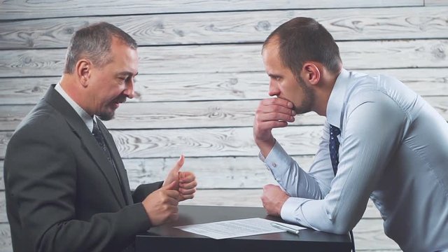 The manager persuades and forces the client to sign a contract.