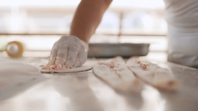 A man prepares delicious traditional Turkish cakes Pida. 4k