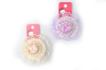 Ornament, bauble, costume jewelry, hairpin on the white isolated background