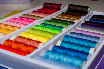 Close-up multicolored sewing threads. Multicolored background