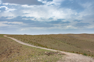 desert mountain with dramatic sky