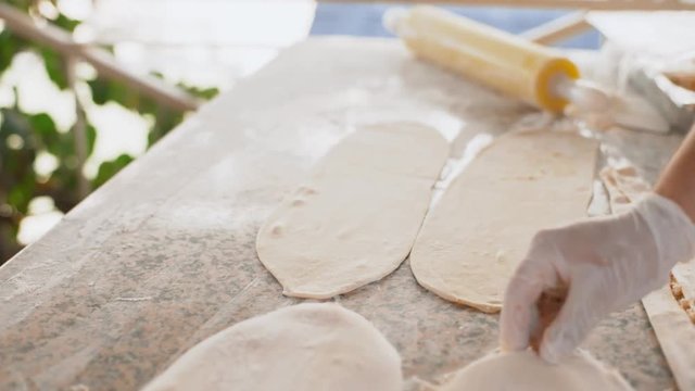 A man prepares delicious traditional Turkish cakes Pida. 4k