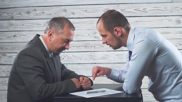 The manager persuades and forces the client to sign a contract.