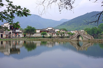 Fototapeta na wymiar The Water Reflection of Hongcun village in morning. Hongcun Village, Anhui province, China : one of most attractive ancient village in China.