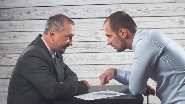 The manager persuades and forces the client to sign a contract.