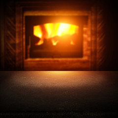 Table background of free space for your decoration and fireplace 