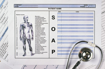Patient SOAP note sheet, stethoscope on light background. Flat lay.