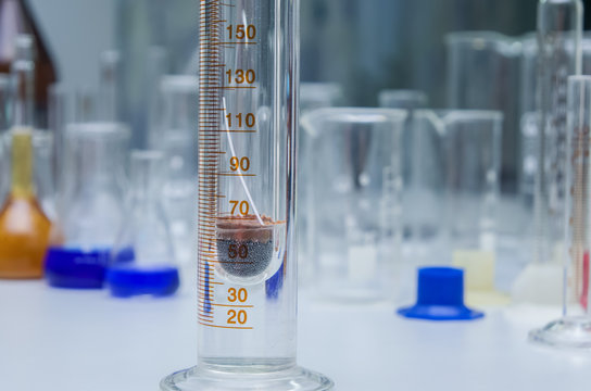 Laboratory thermometer, hydrometer and measuring cylinder - Powered by Adobe