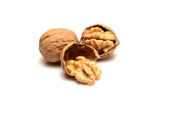 Walnut and kernels, whole walnut and kernels, close-up macro, isolated on a white background.