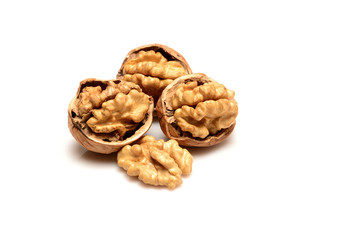 Three open walnuts and kernel, close-up macro, isolated on a white background.