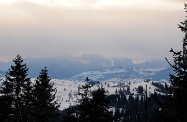 winter mountains in the morning haze